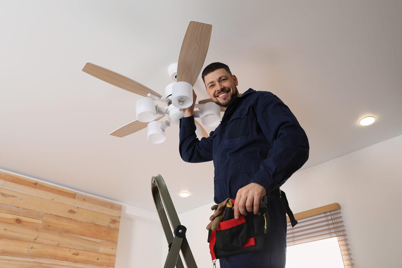 Electrician working on a ceiling fan