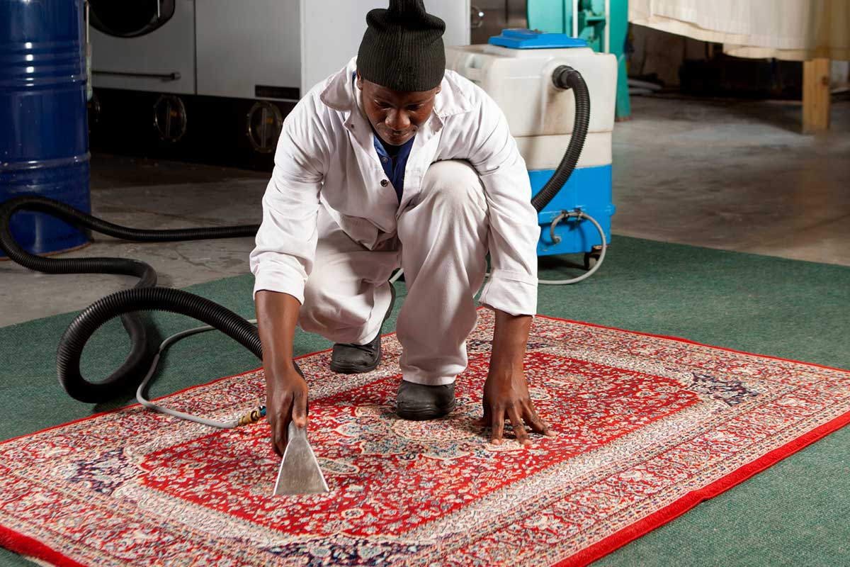 vacuuming a persian rug