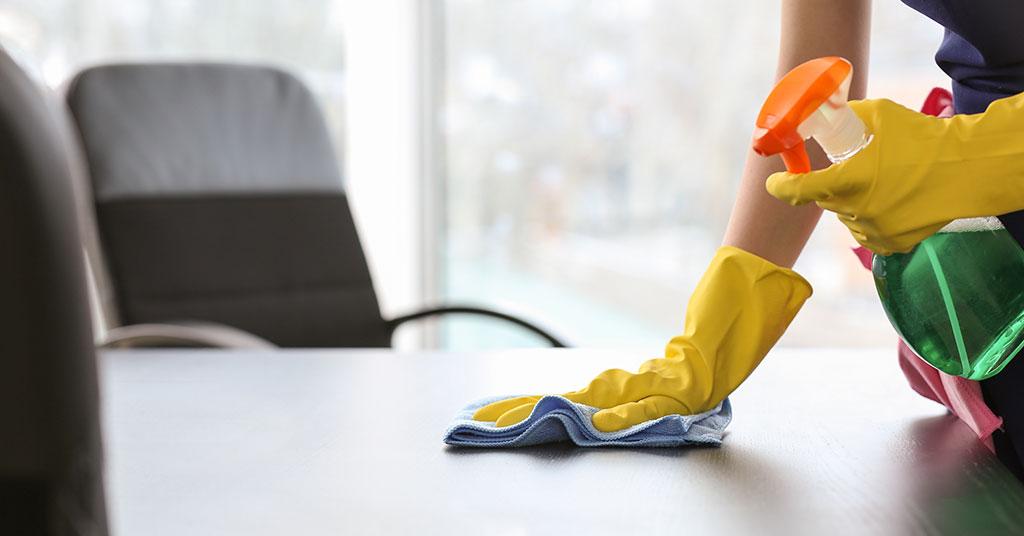 Woman Cleaning The Window Sill In Office Stock Photo - Download